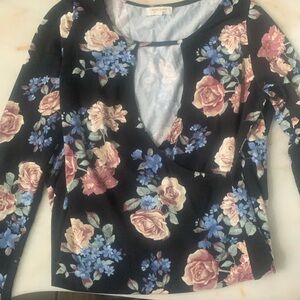 I am selling a black, pink and blue floral long sleeve body con dress!!